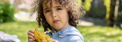 Boy Eating Elote